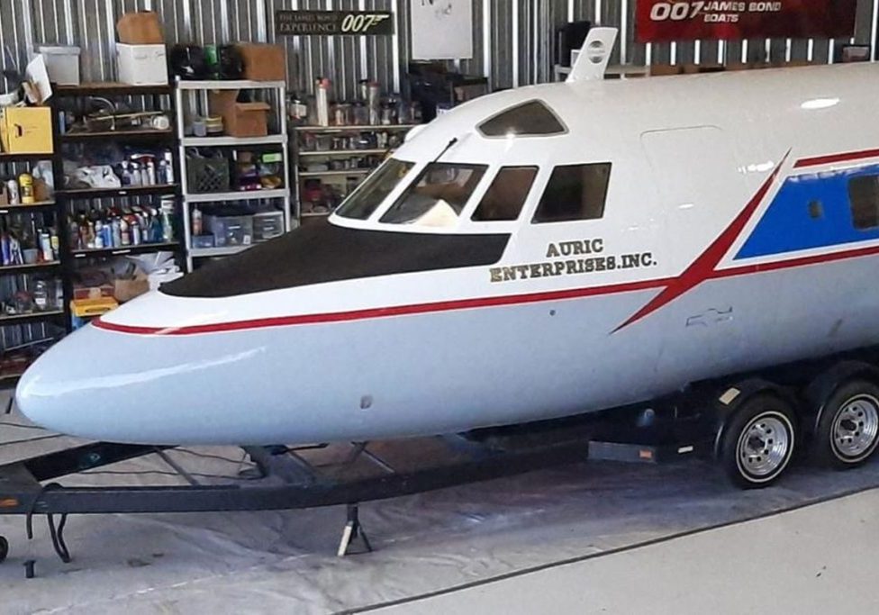 Cockpit of a white and blue jet plane